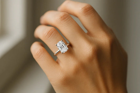 Lab grown engagement ring with a large elongated center stone, worn on a hand