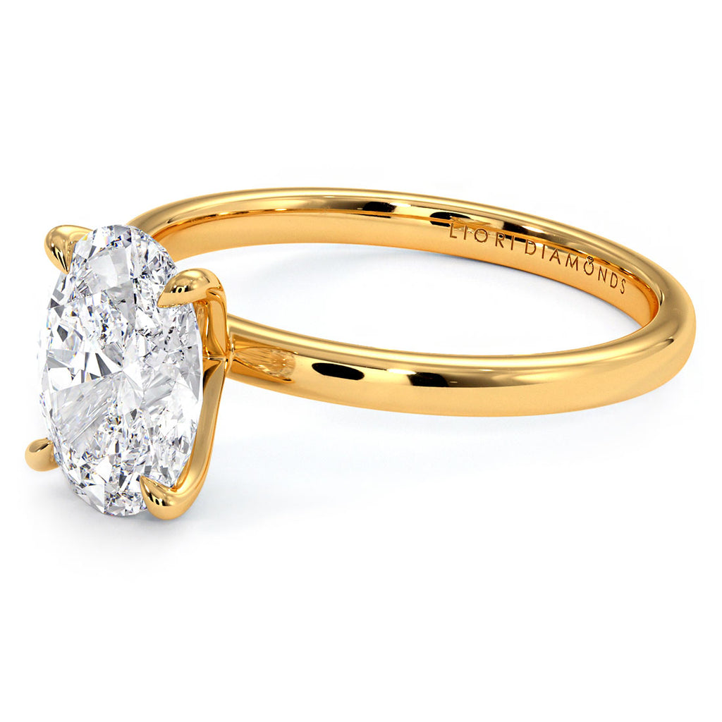 2.07ct GIA Certified Oval Cut Petite Wire Solitaire Lab Grown Diamond Engagement Ring set in 14k Yellow Gold