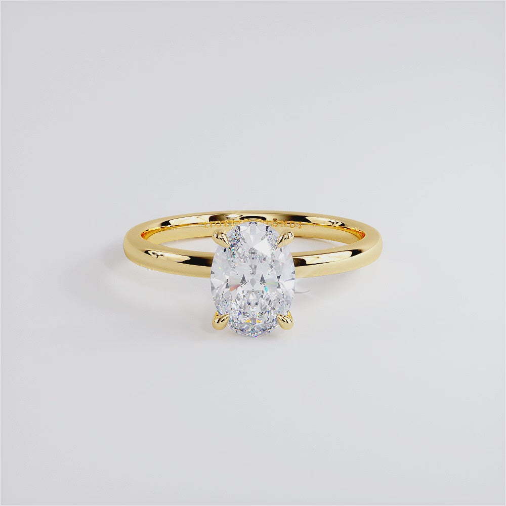 1.50ct GIA Certified Oval Cut Petite Wire Solitaire Lab Grown Diamond Engagement Ring set in 14k Yellow Gold