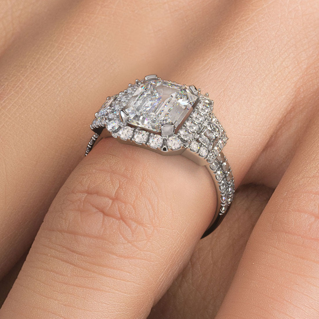 2 Carat Emerald Cut Three Stone Micropavé Halo